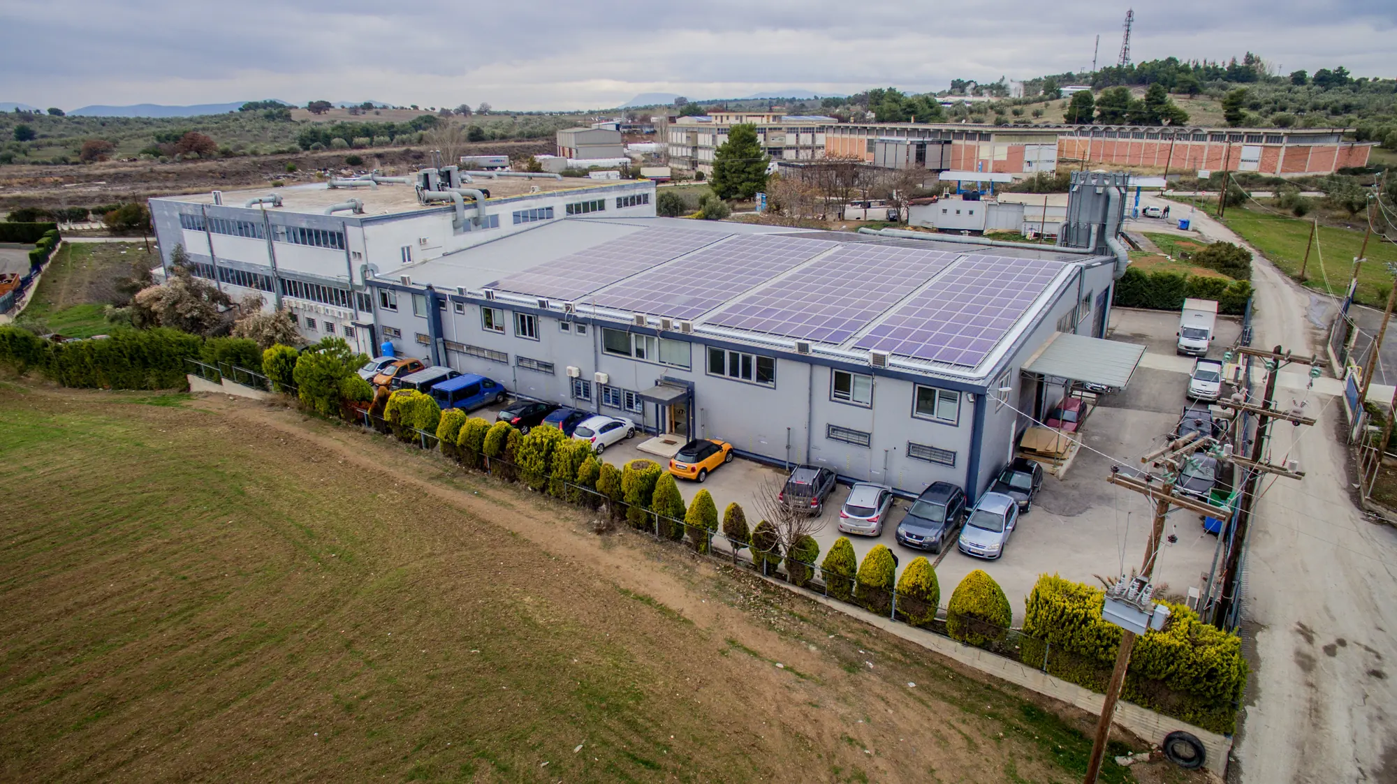Aerial view of the Pafos factory in Inofita, with solar panels on the roof